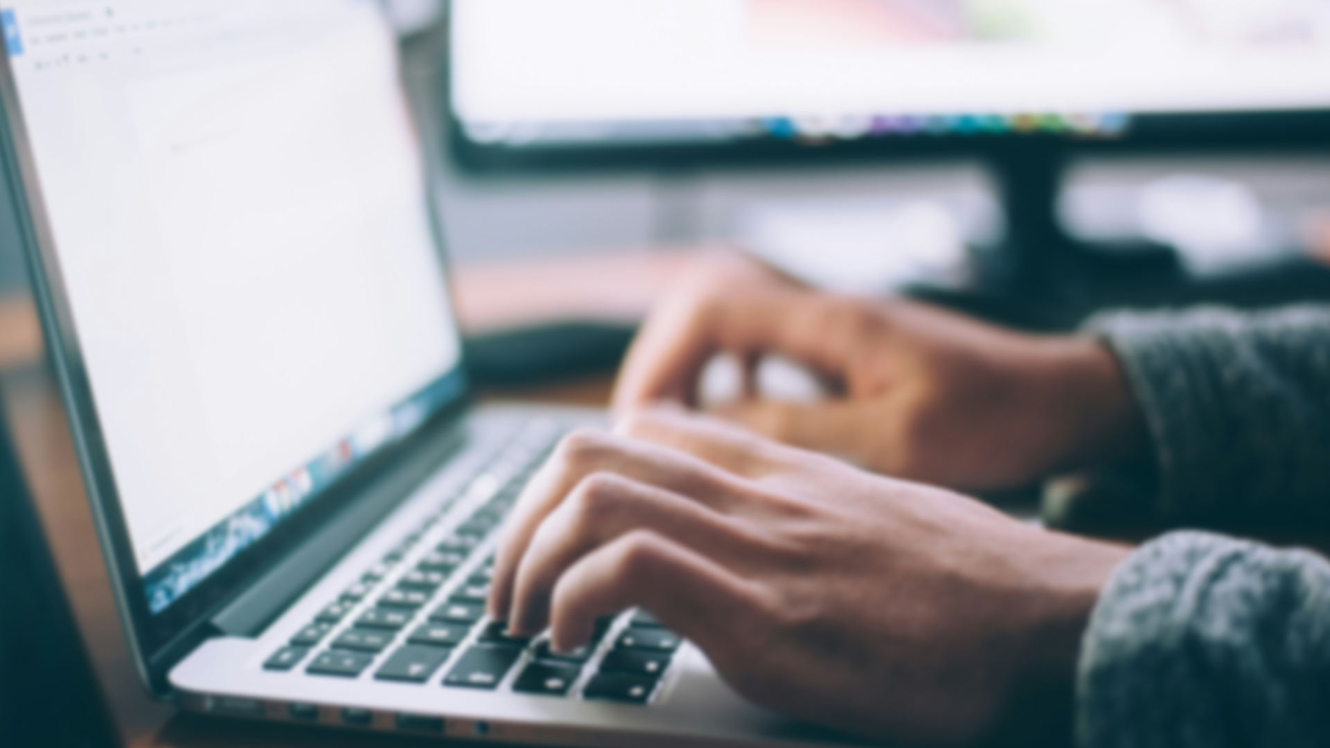 Person typing on computer